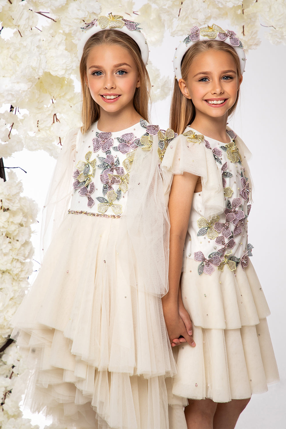 Ivory asymmetrical tulle layered dress with hand-embellished flowers, pearls and crystals and embellished waistline