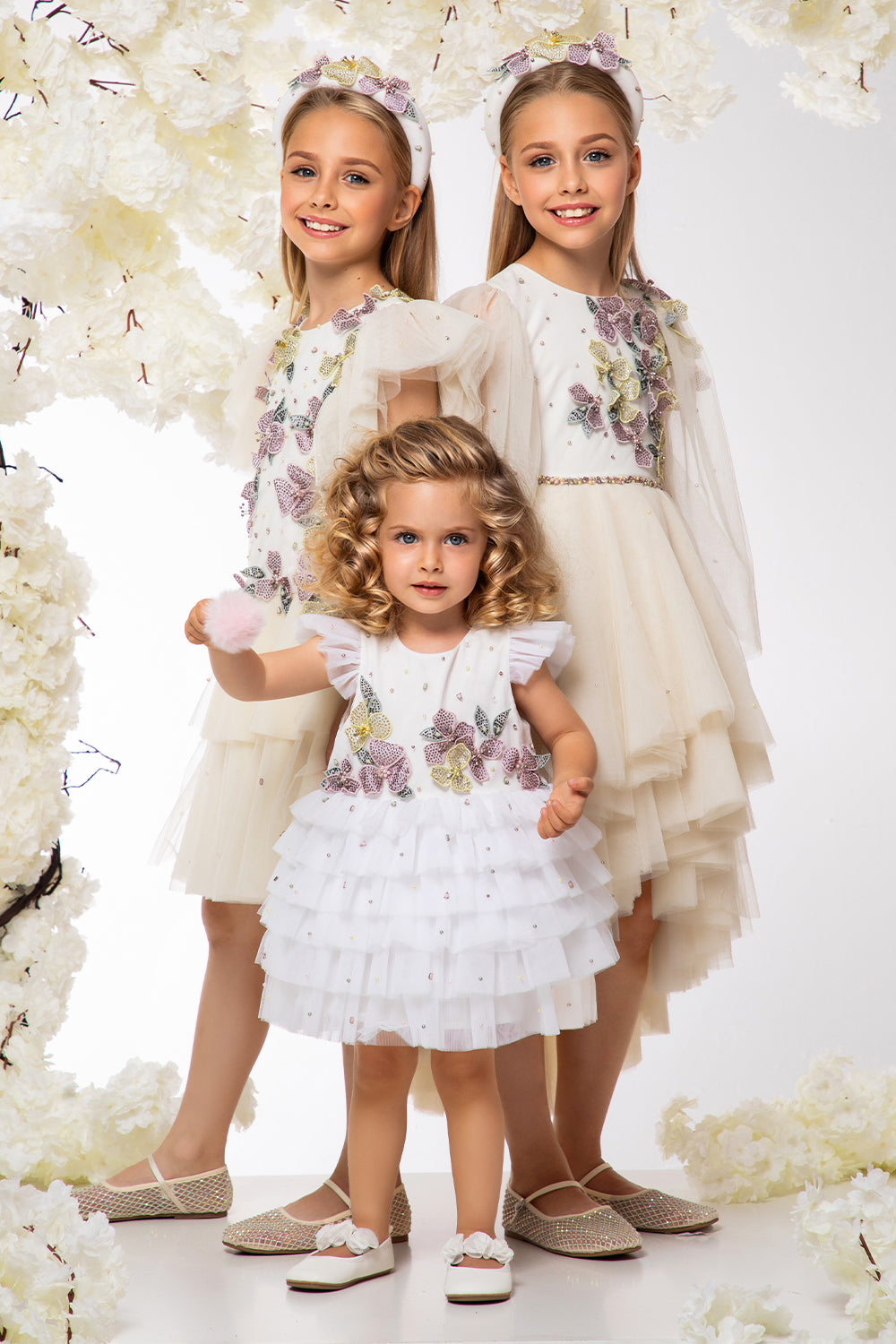 White tulle layered baby dress with hand-embellished flowers, pearls and crystals
