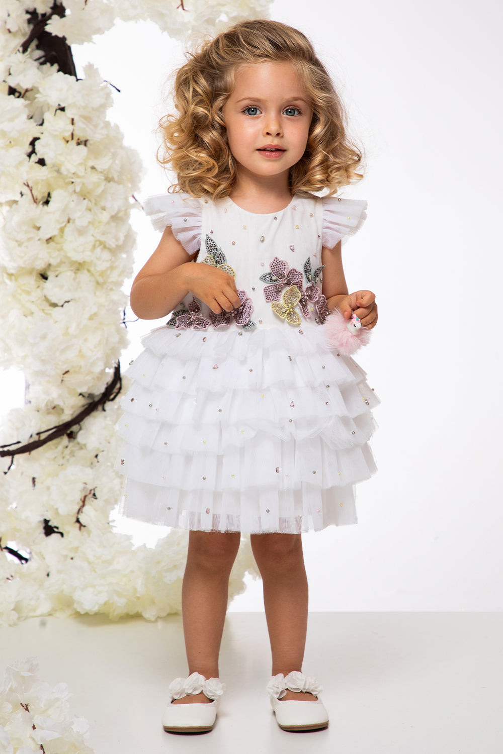 White tulle layered baby dress with hand-embellished flowers, pearls and crystals