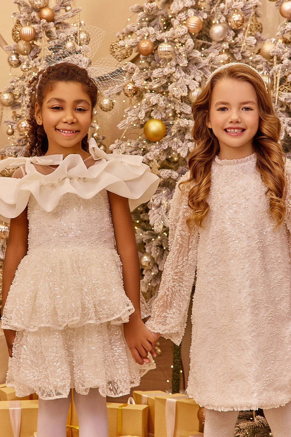 White pearl lace dress with organza frills and shoulder bows