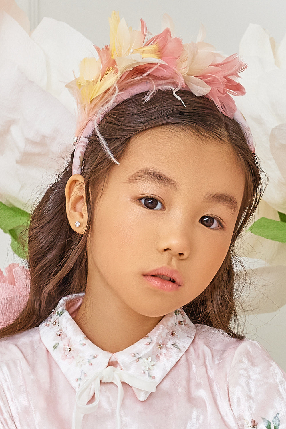 Floral print hairband with yellow and pink feathers