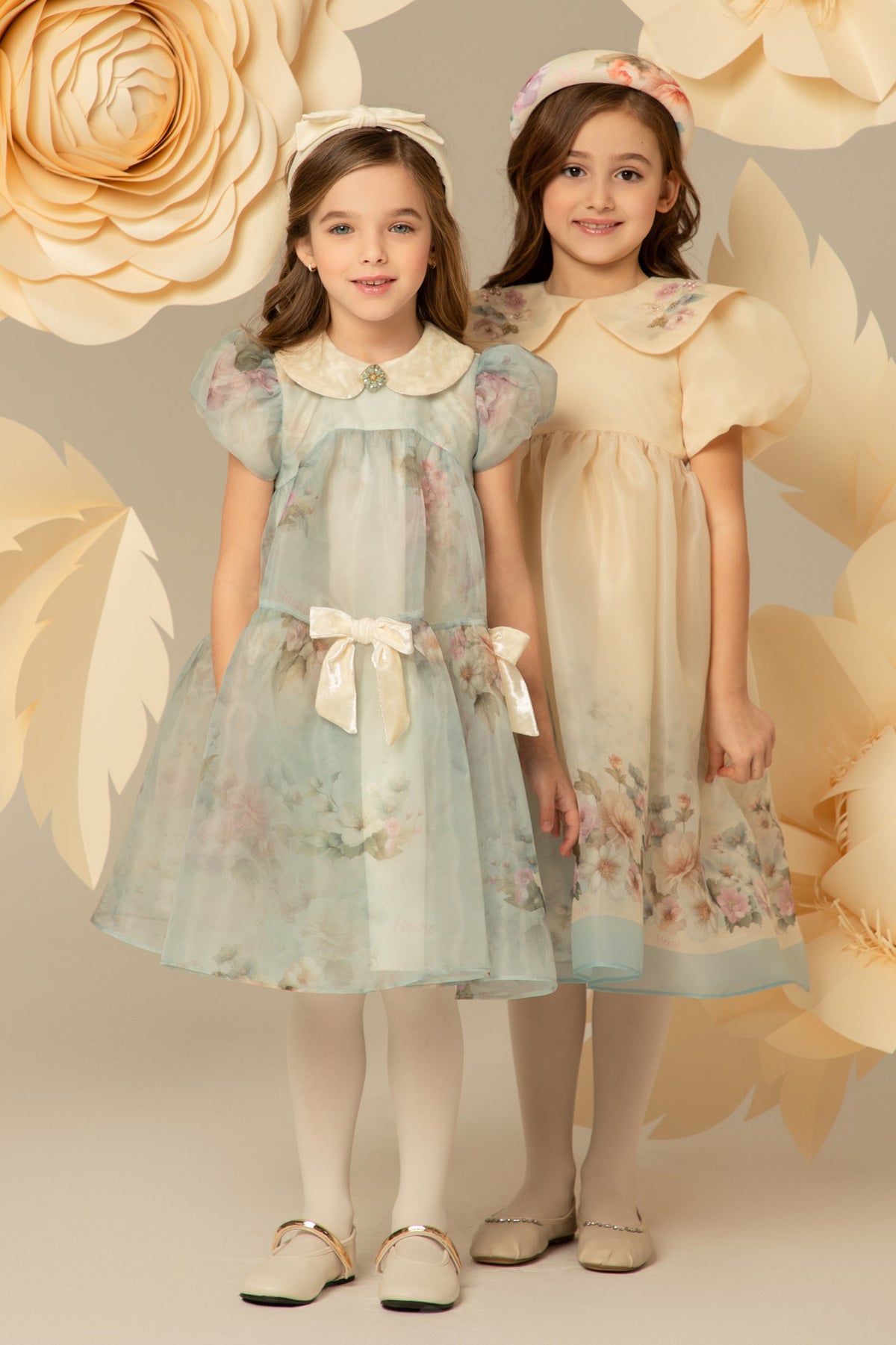 Two girls in floral occasion dresses from the EIRENE collection