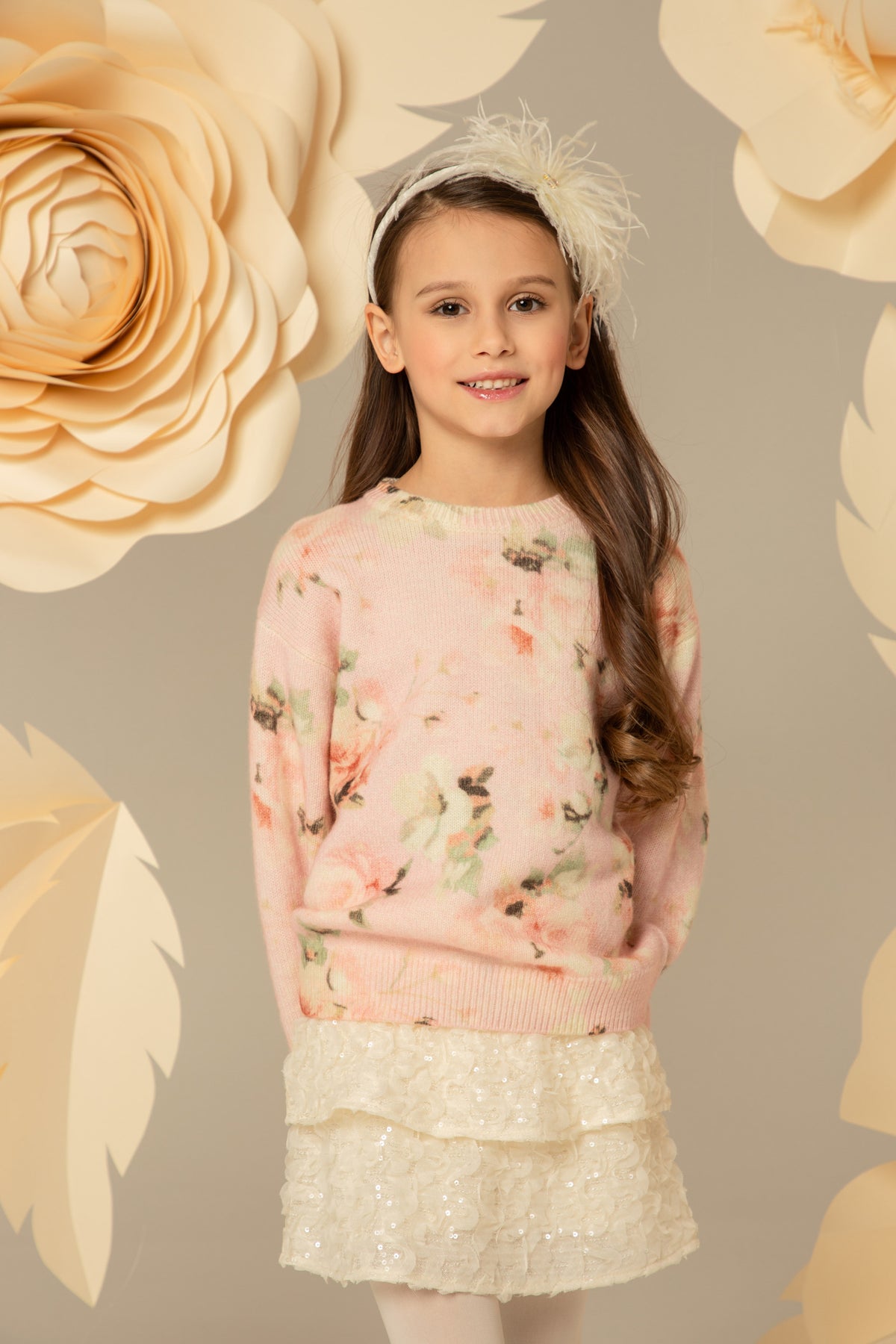 Pink floral sweater worn with an ivory tweed skirt