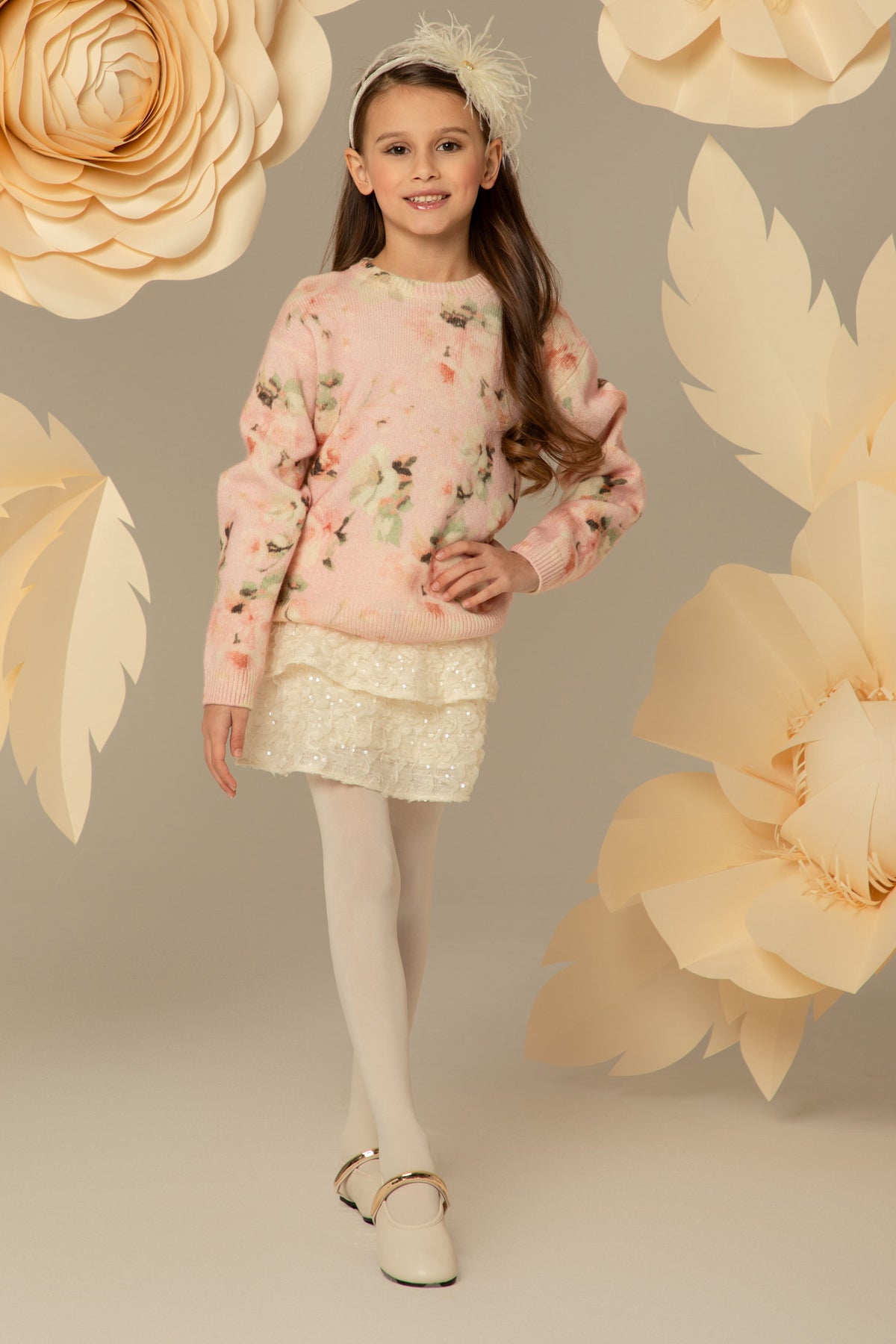 Girl wearing a pink floral wool and cashmere sweater