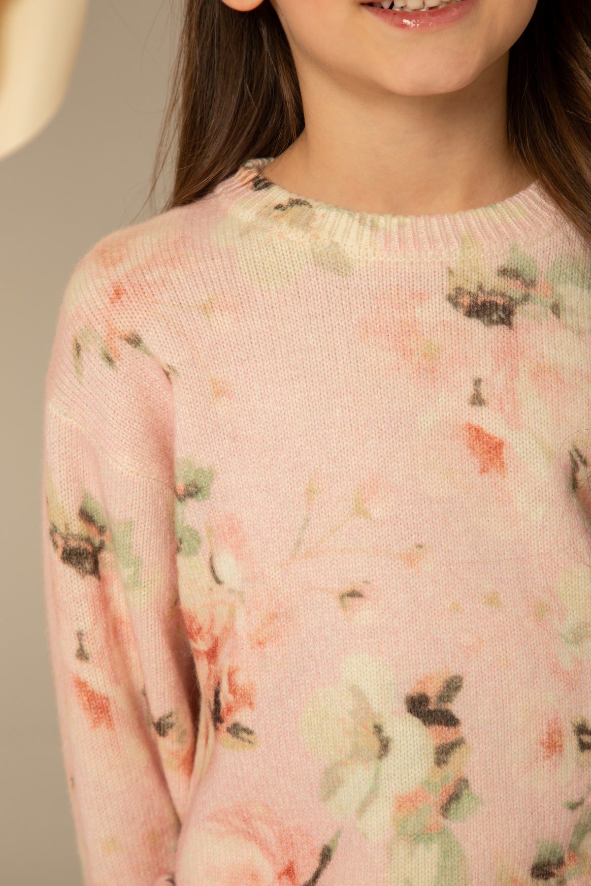 Close view of the floral print on the knit
