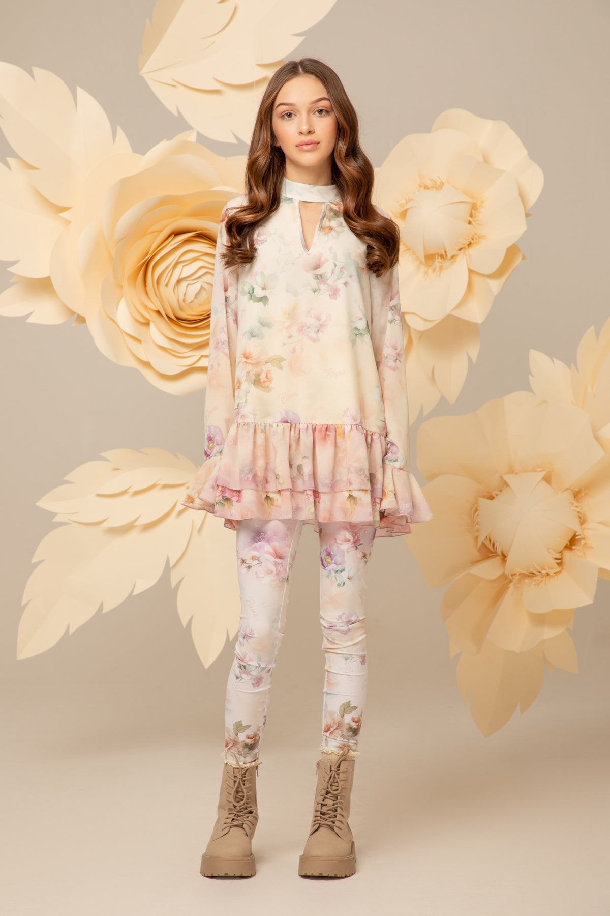 Girl wearing a floral tunic dress with flounced hem