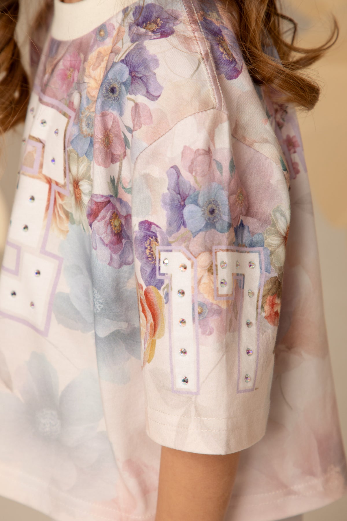 Close-up of the hand-set crystals on the t-shirt