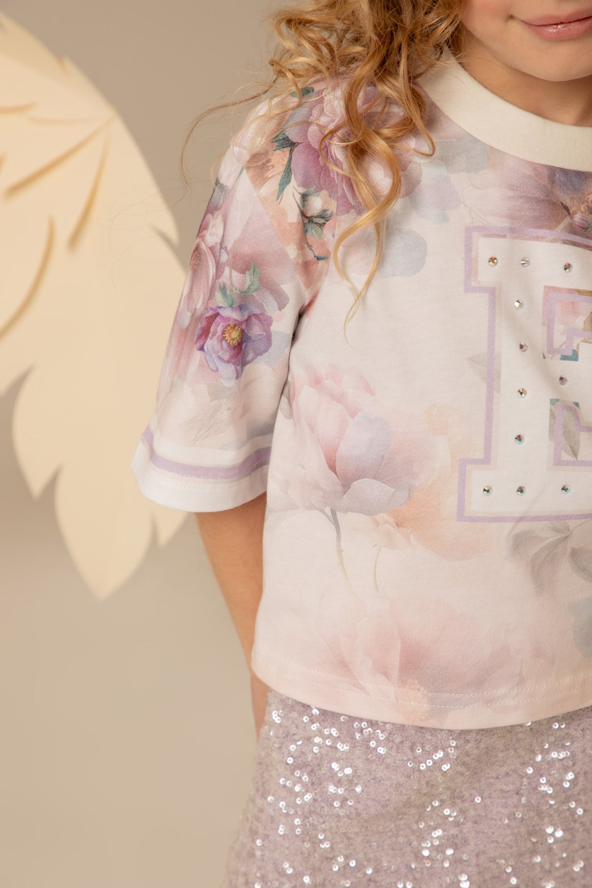Detail of the crystal E across the chest