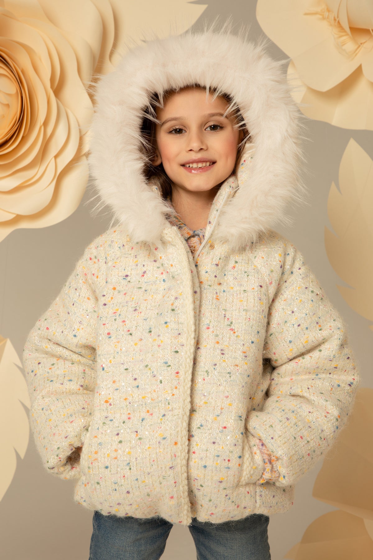 The jacket worn with the hood up