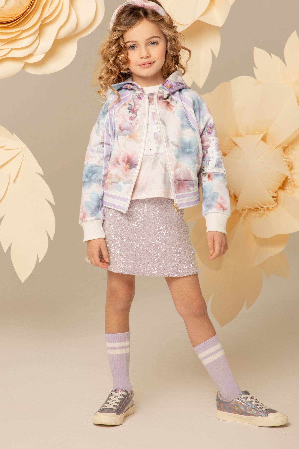 Girl wearing a lilac sequin A-line skirt