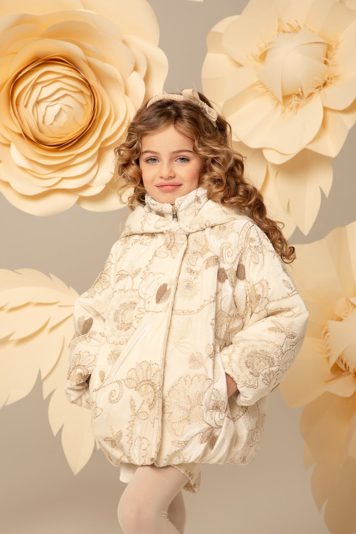 Ivory velvet coat with the high neck fastened