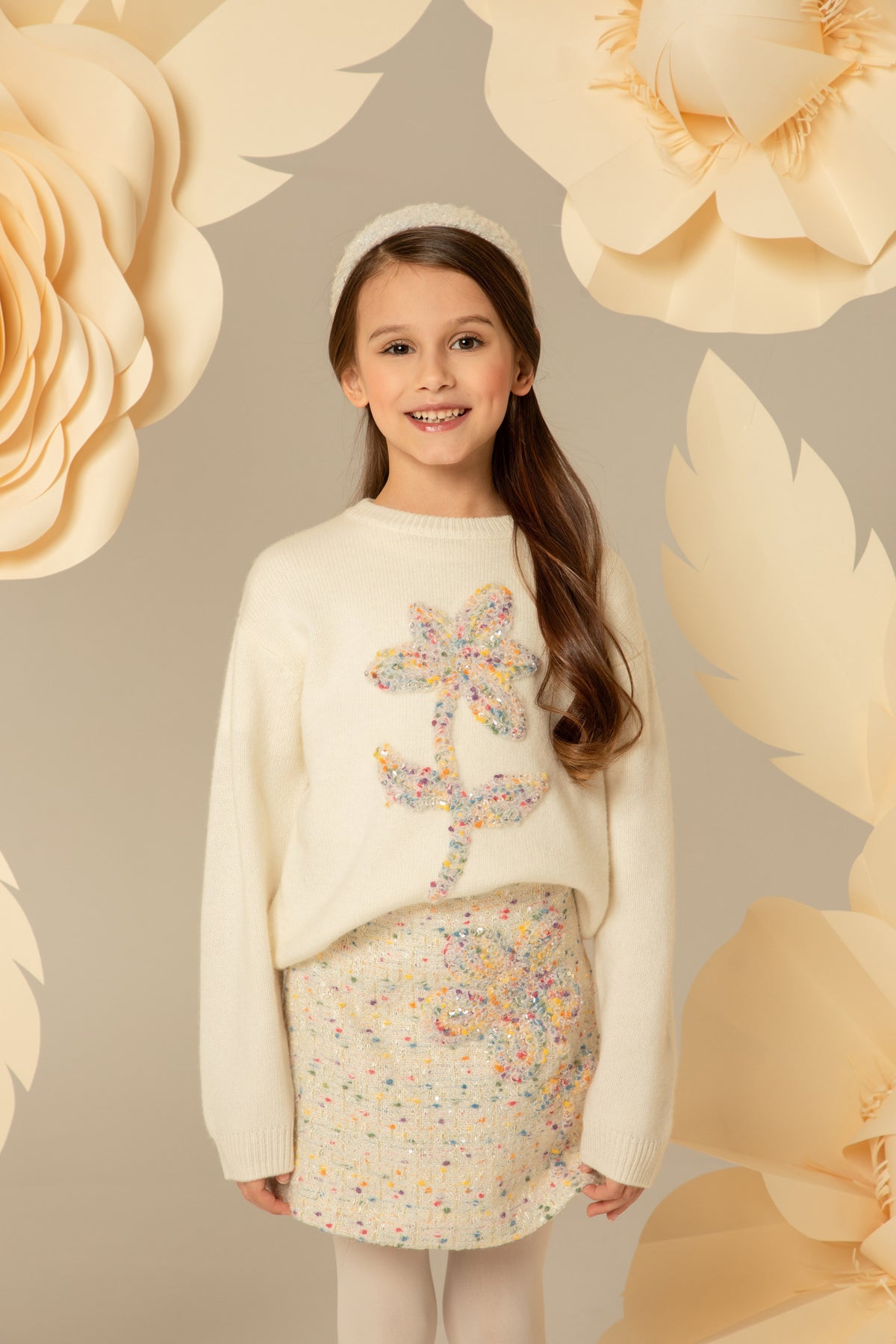 Cream tweed skirt worn with a matching knit sweater