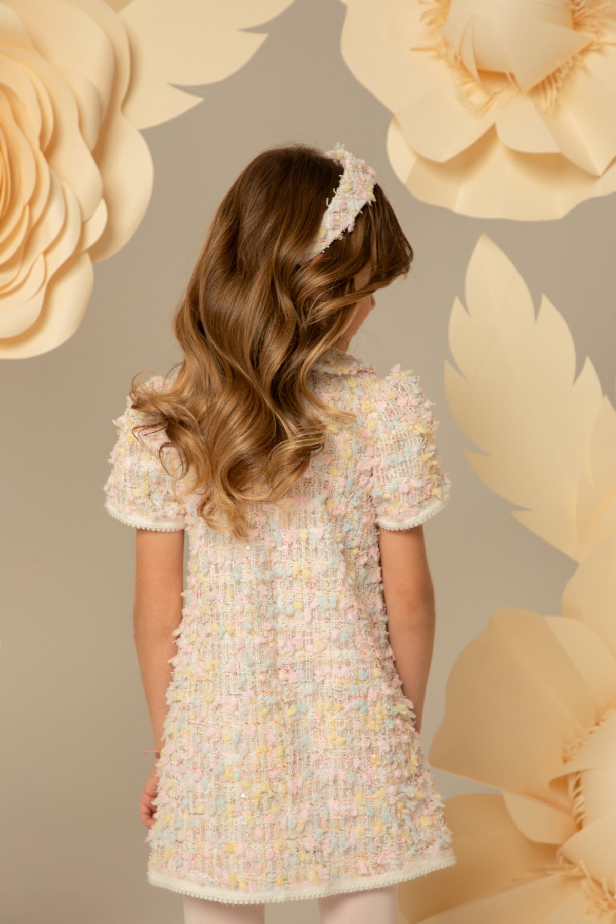 Back view of a pastel tweed dress