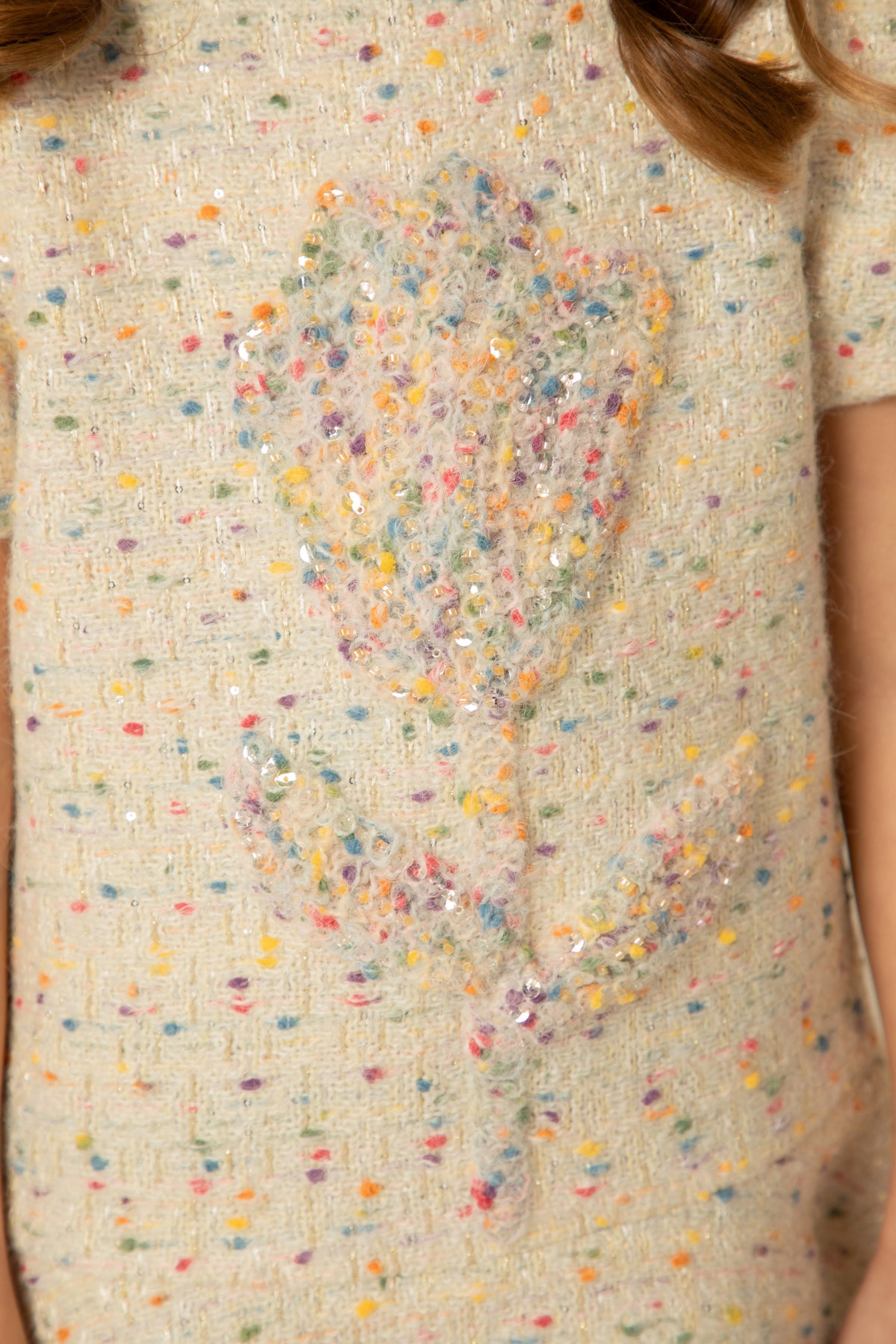Detail of the sequinned flower appliqué