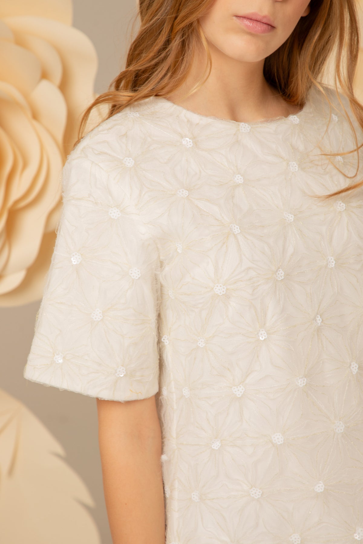 Close view of the floral appliqués and sequins