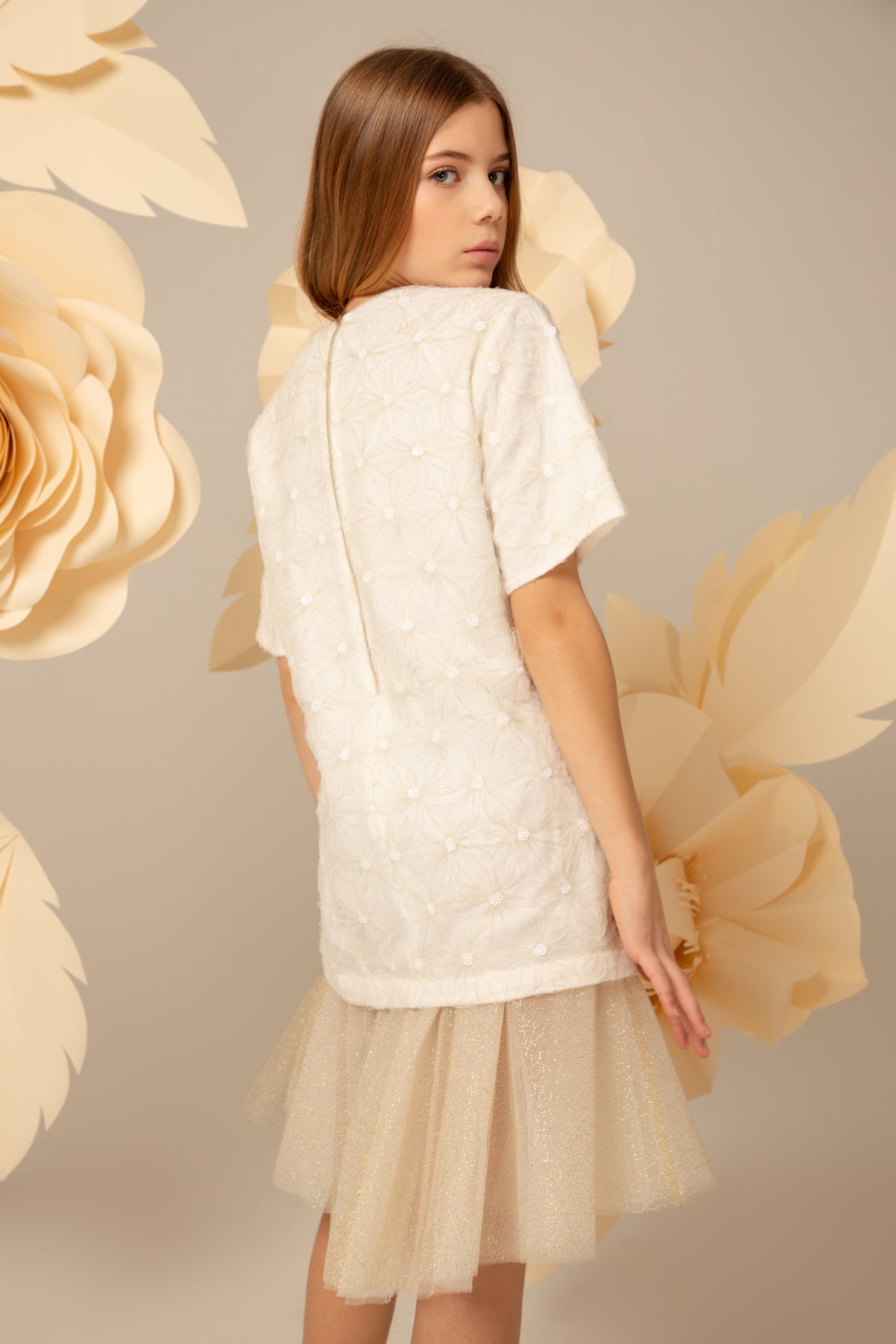 Back view of the ivory dress with a tulle hem