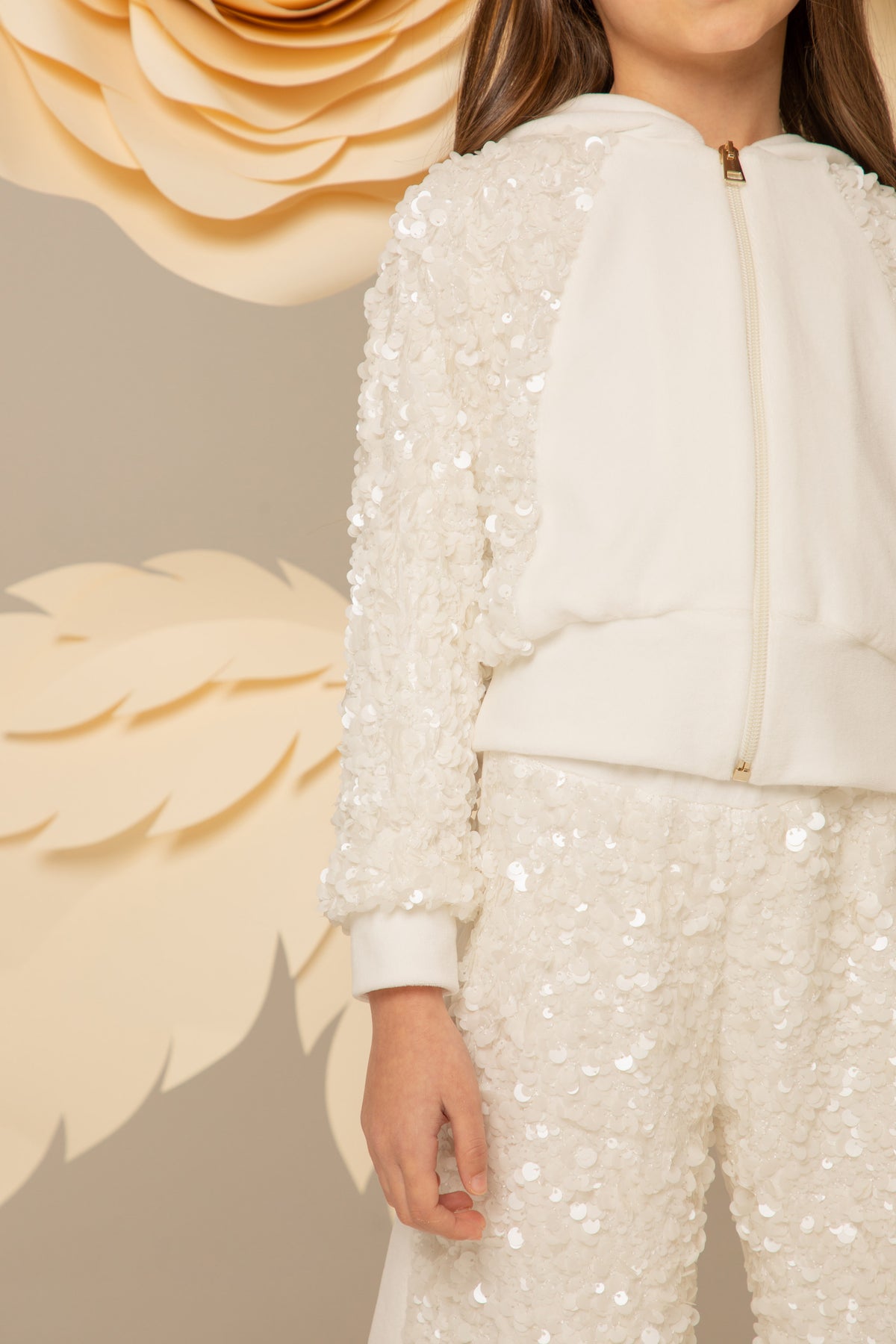 Back view of an ivory velvet sequinned set