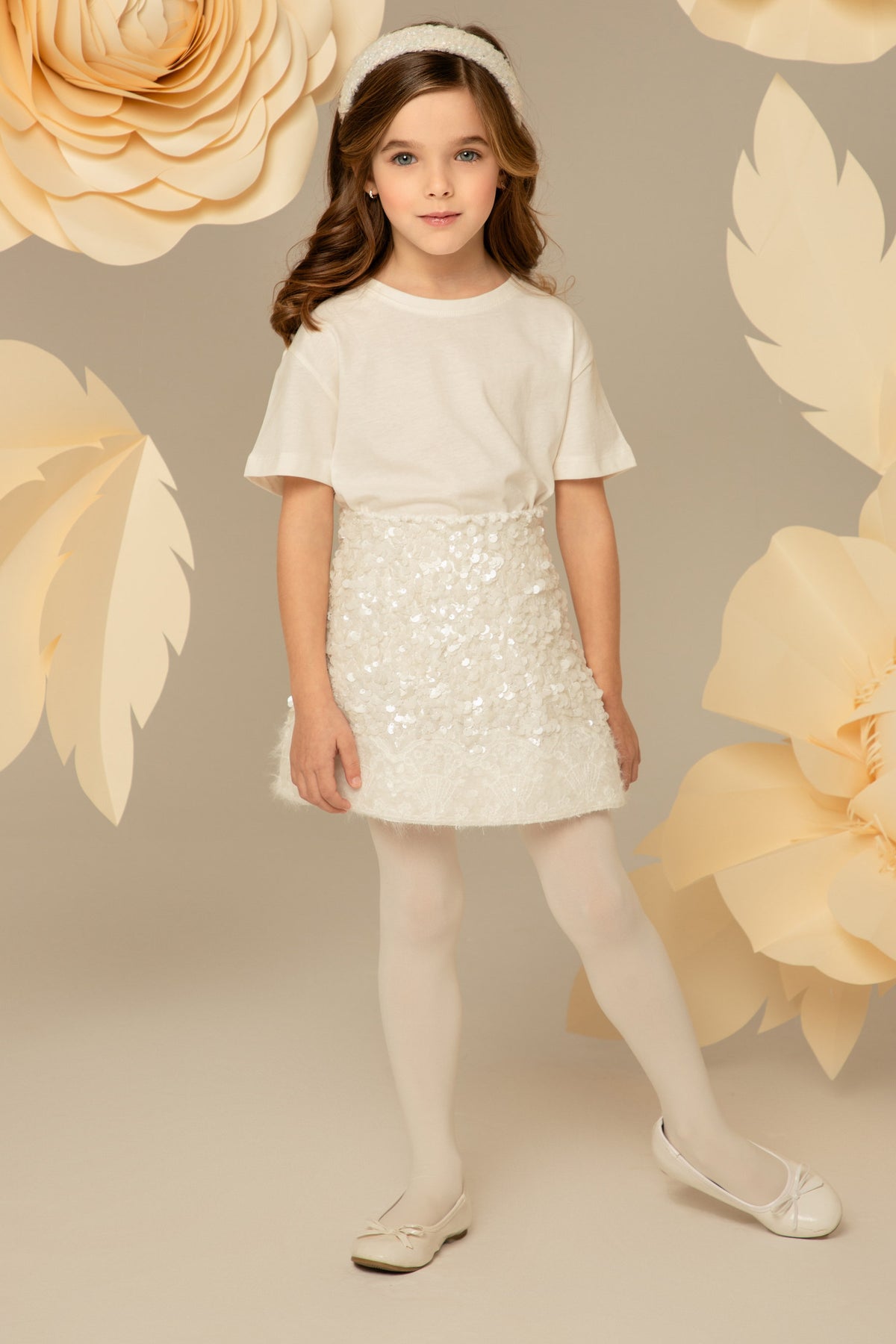The white sequin skirt worn with a plain top