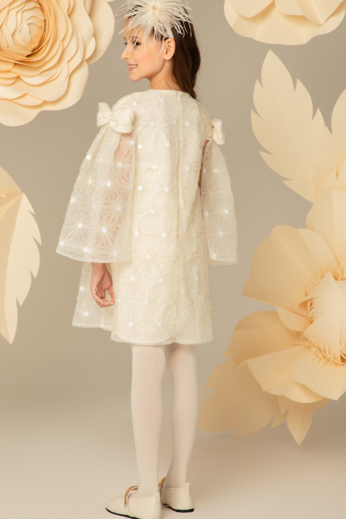 Side view of the ivory lace dress and cape sleeves