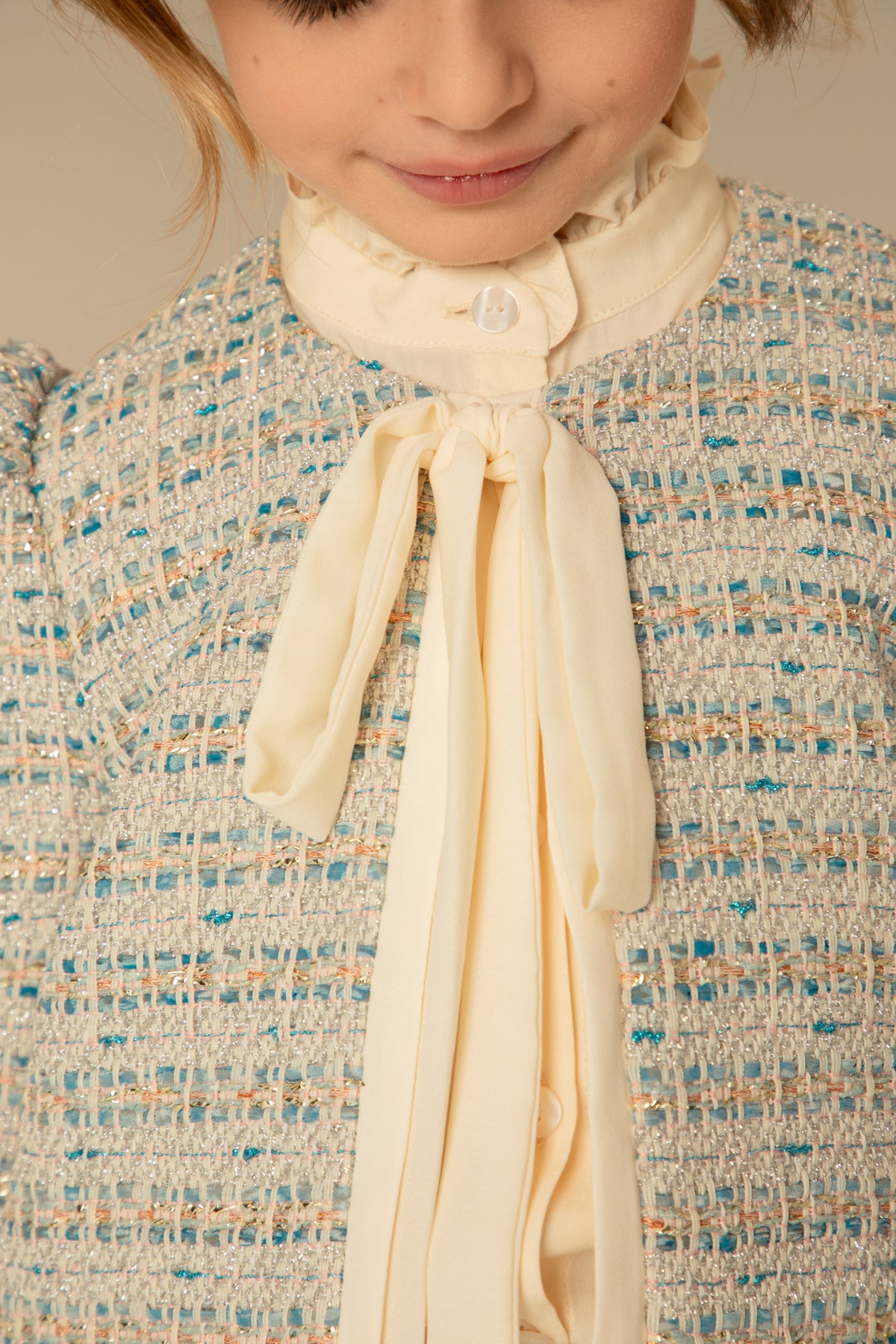 Close view of the bow tie and blouse detailing