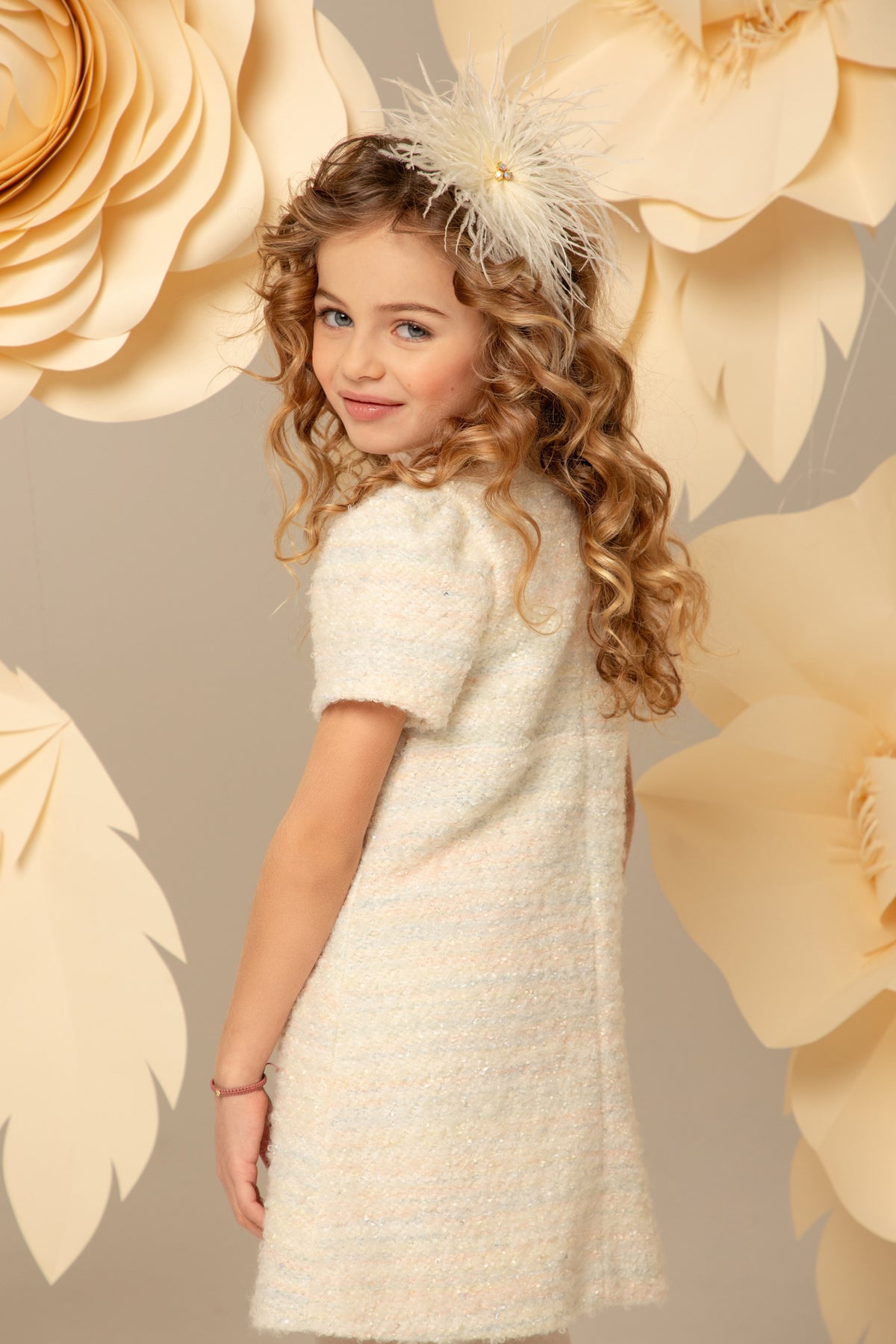 Side view of the ivory tweed dress