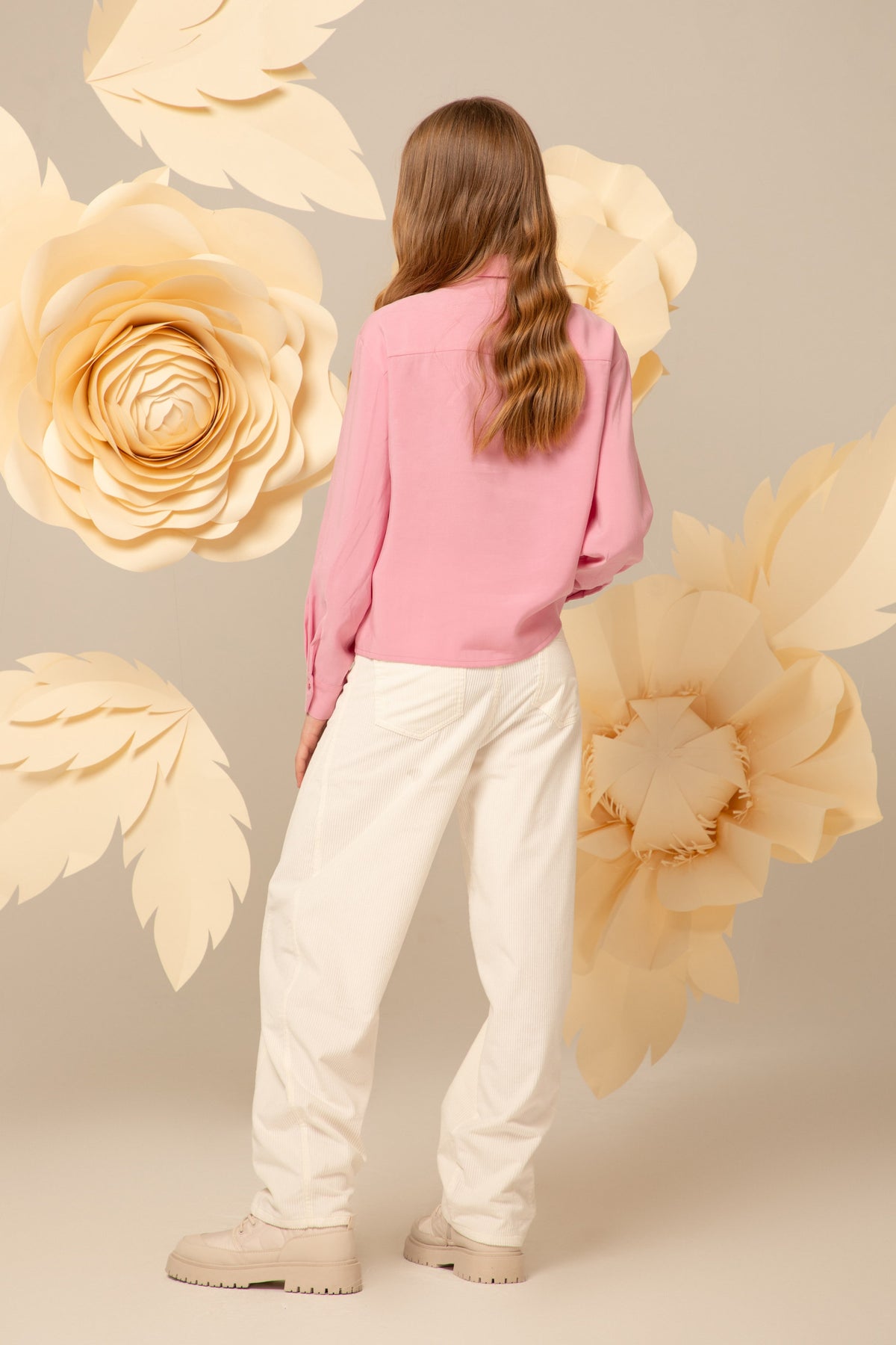 Back view of the soft pink blouse