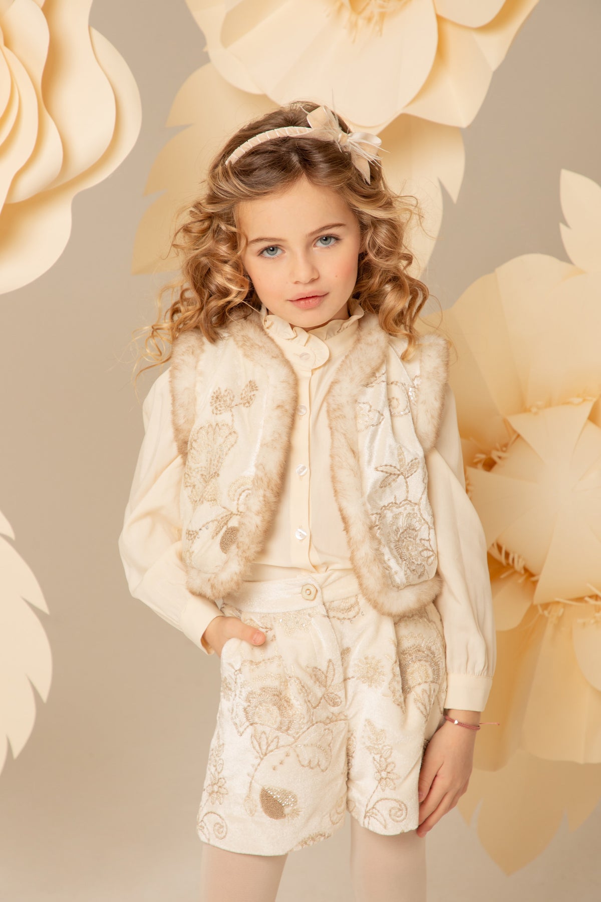 Ivory velvet vest with faux fur trim