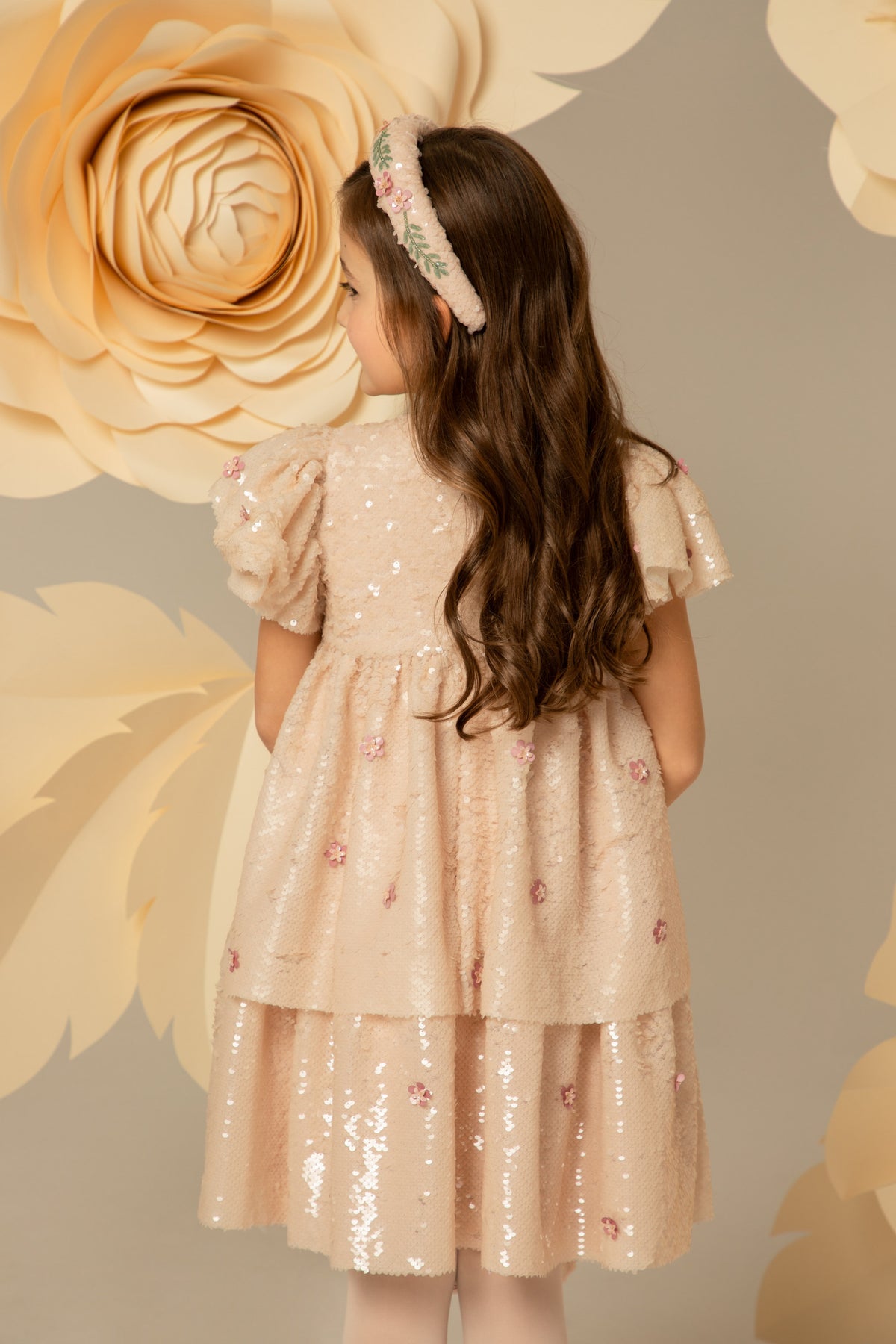 Back view of the layered dusty pink dress