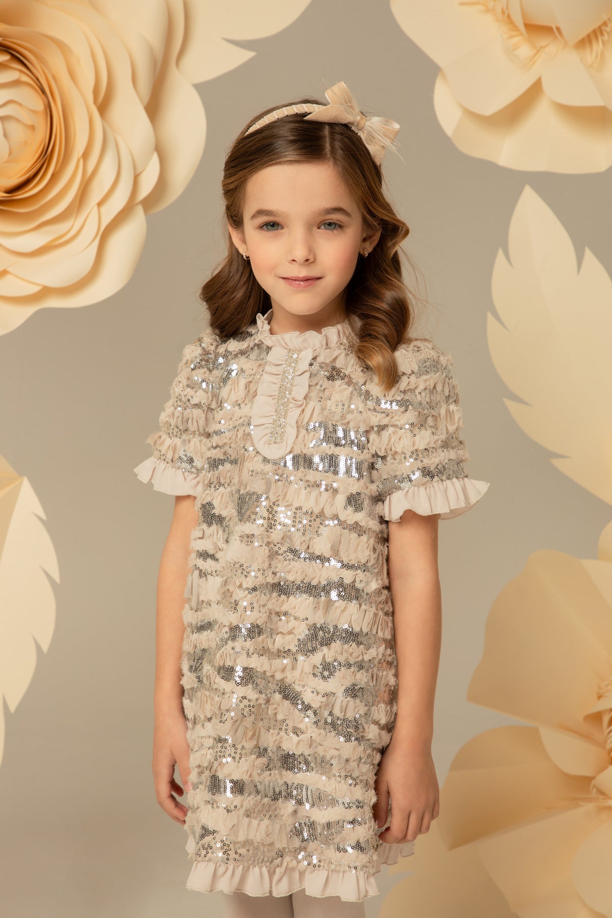 Beige sequinned dress with ruffle trim at the sleeve