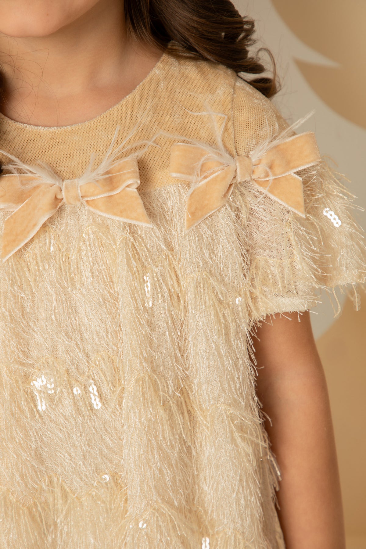 Close view of the fringing and velvet bow