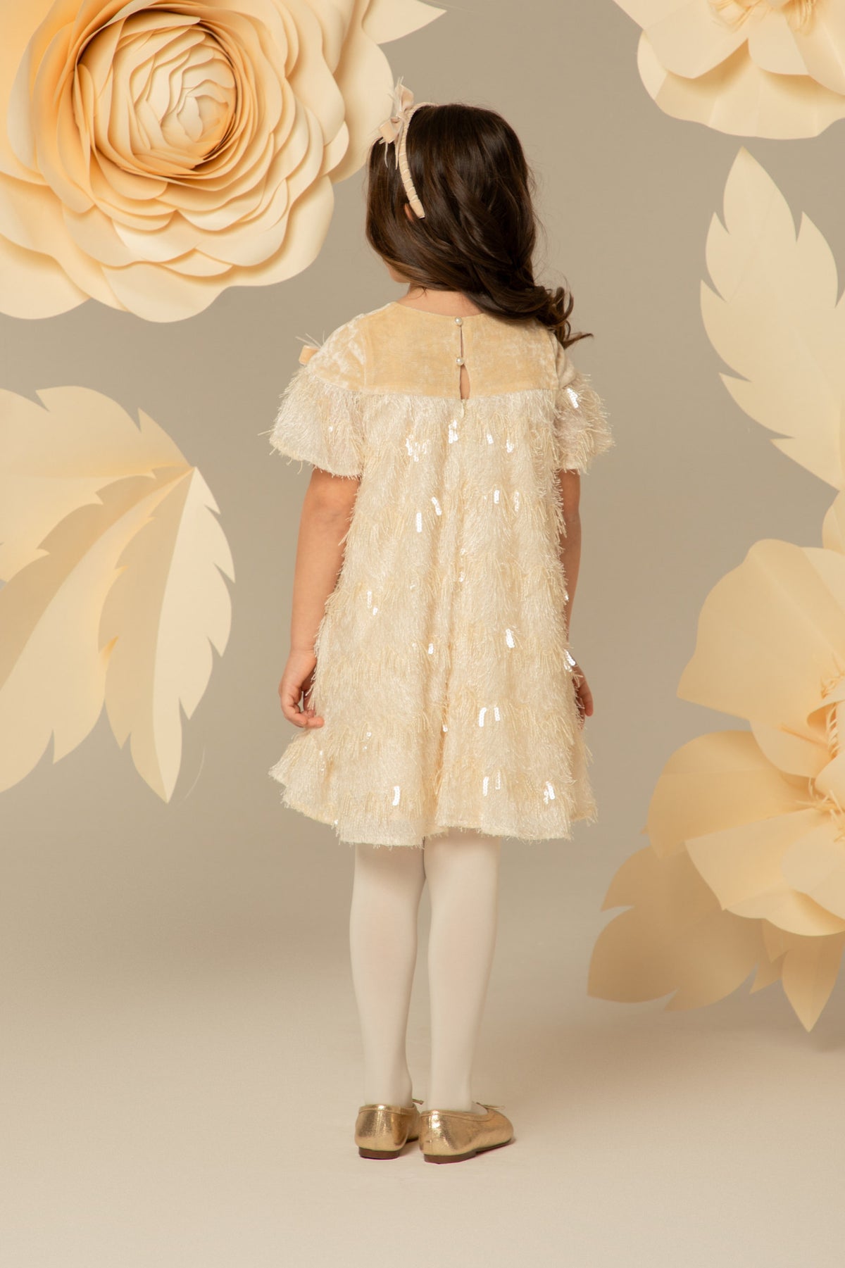 Back view of the ivory fringed dress