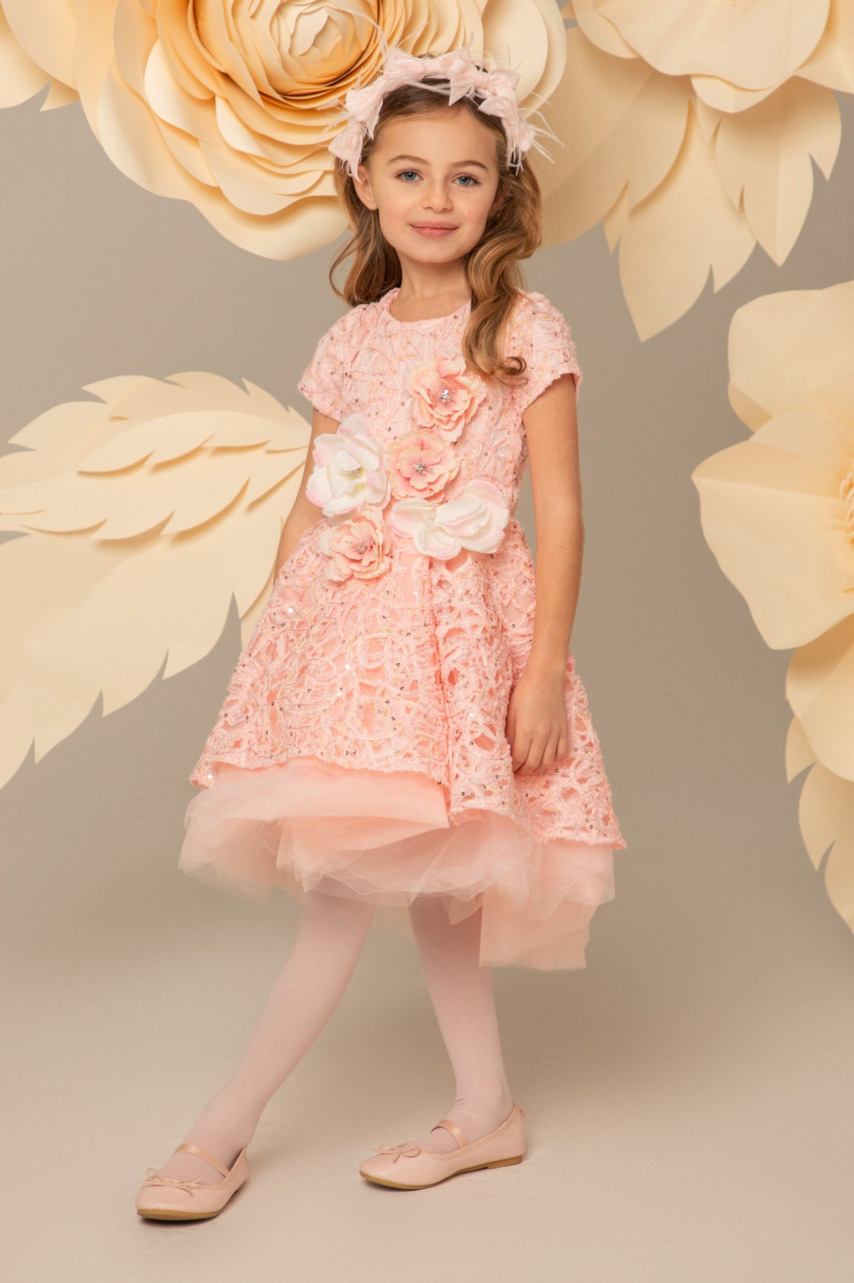 Pink lace dress with gold detail and large flowers
