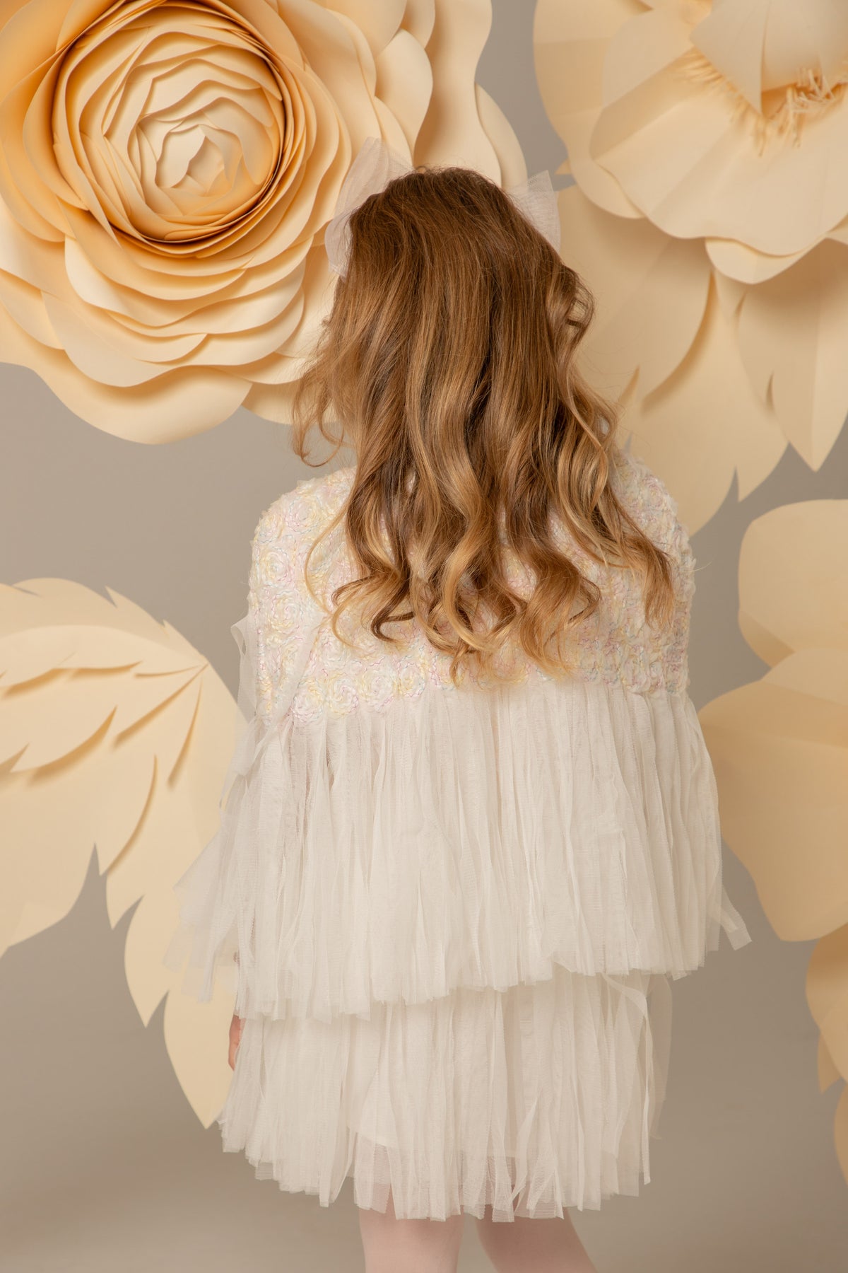 Back view of the white lace cape