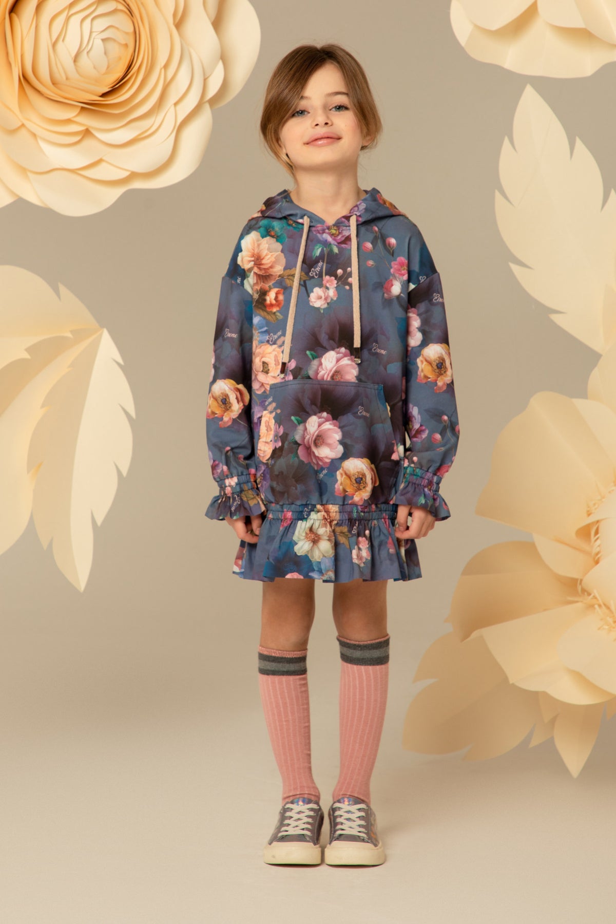 Girl wearing a blue floral hooded tunic dress