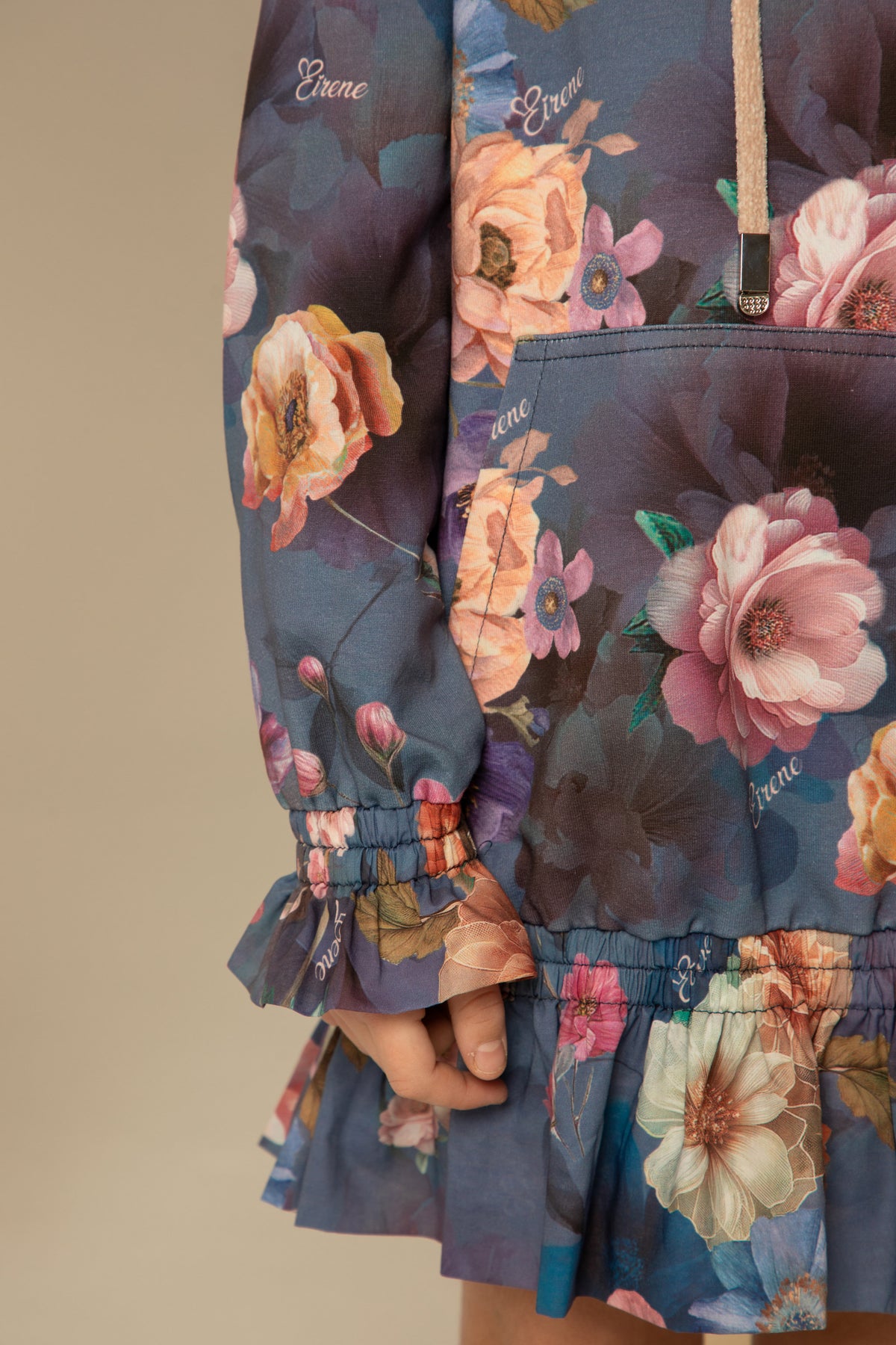Close view of the ruffled hem and floral print