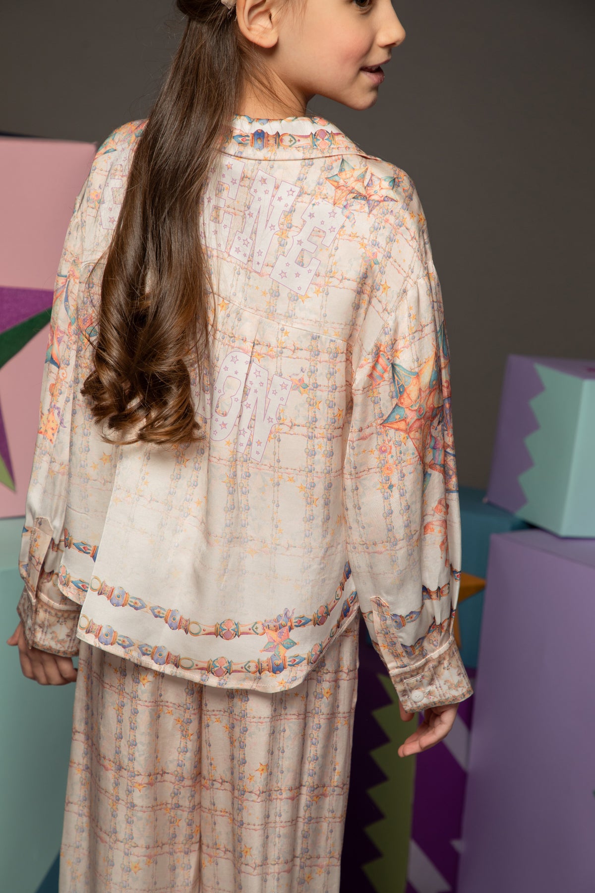 Back view of a silky printed two-piece set