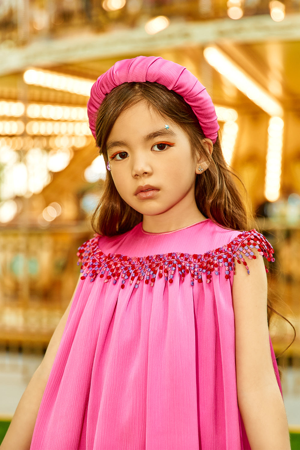 Fuchsia shiny asymmetrical dress with multicolor fringes