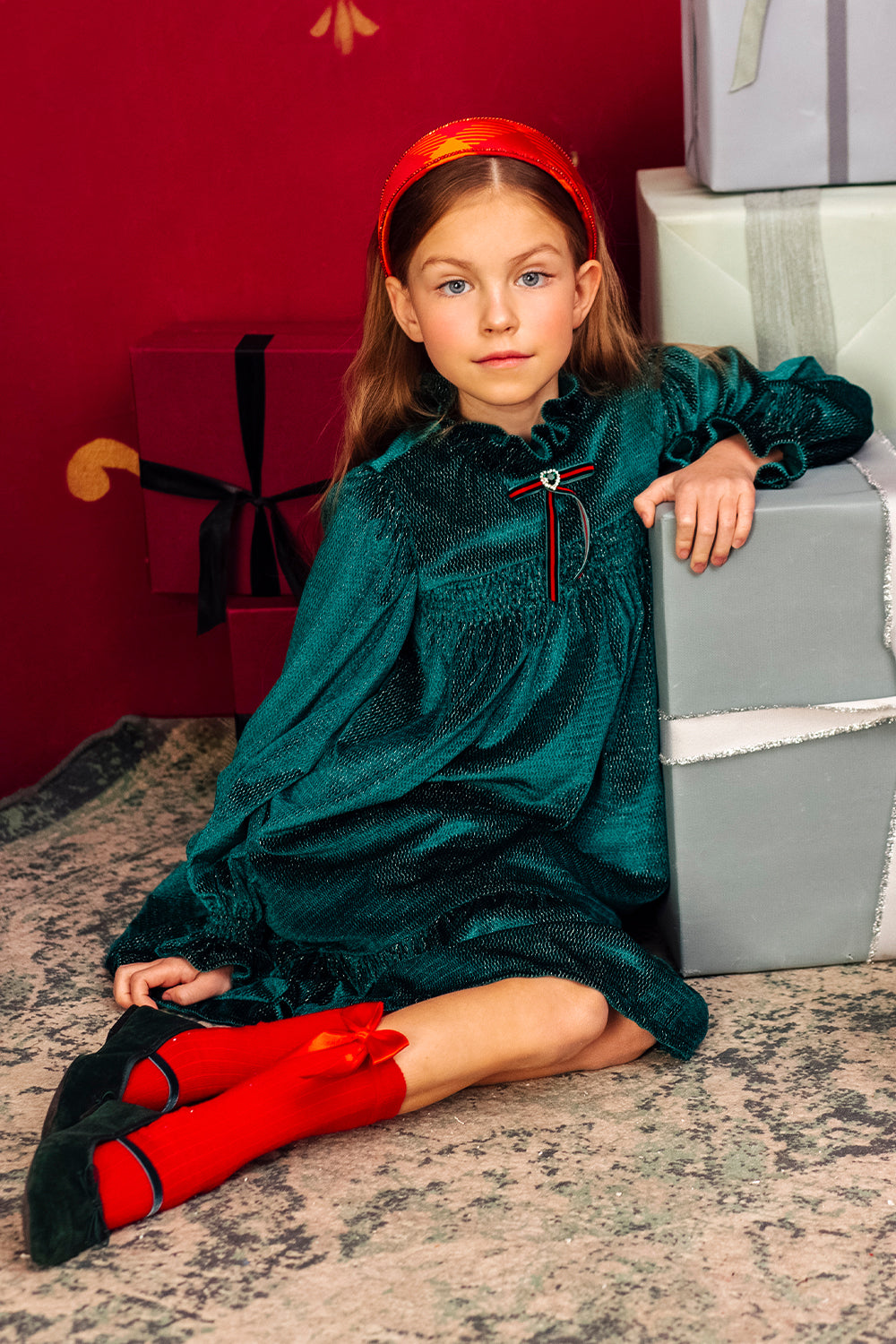 Green and gold shimmering smocked dress with red/green velvet ribbon and green heart shape crystal button