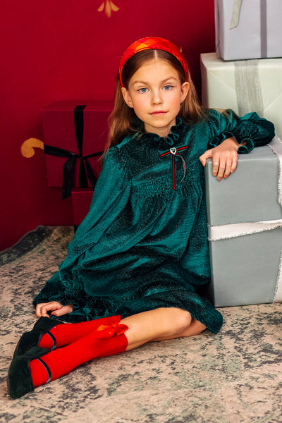 Green and gold shimmering smocked dress with red/green velvet ribbon and green heart shape crystal button