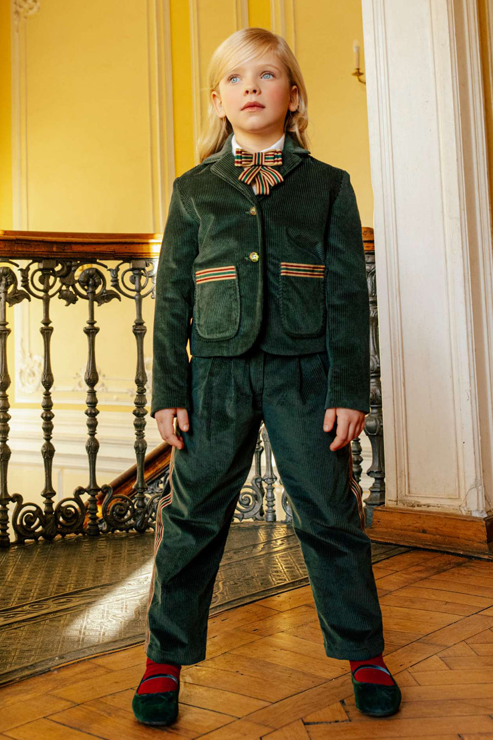 Green courdory trousers with colored ribbons on the legs