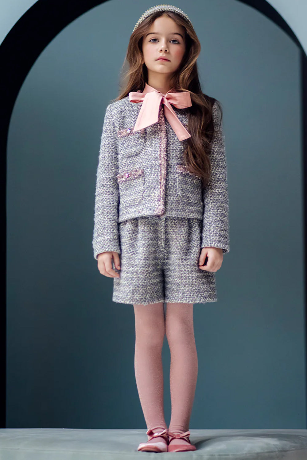 Grey and ivory jacket and shorts tweed set with matching grey and pink trimming and gold buttons