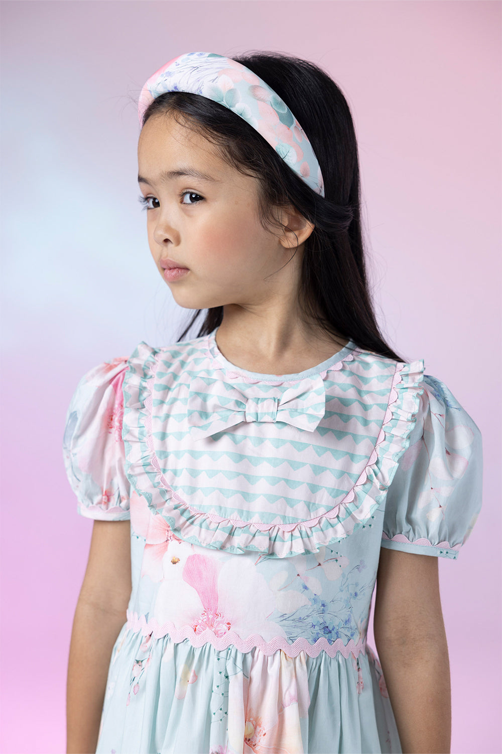 Light blue floral cotton dress with geometric pattern front detail and bow