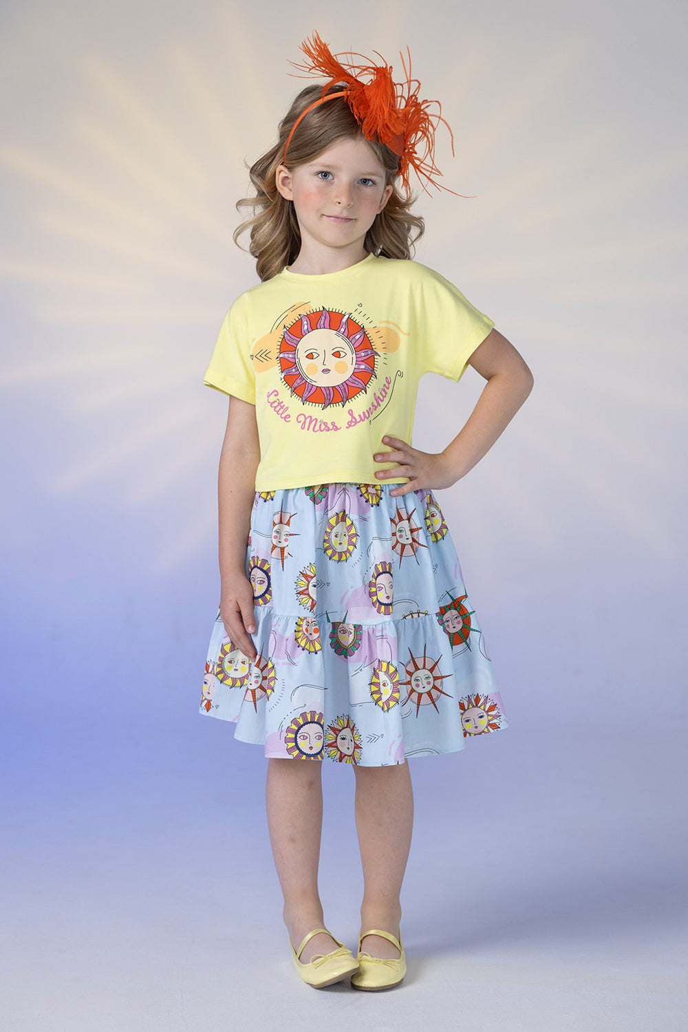 Light blue satin cotton skirt with suns print