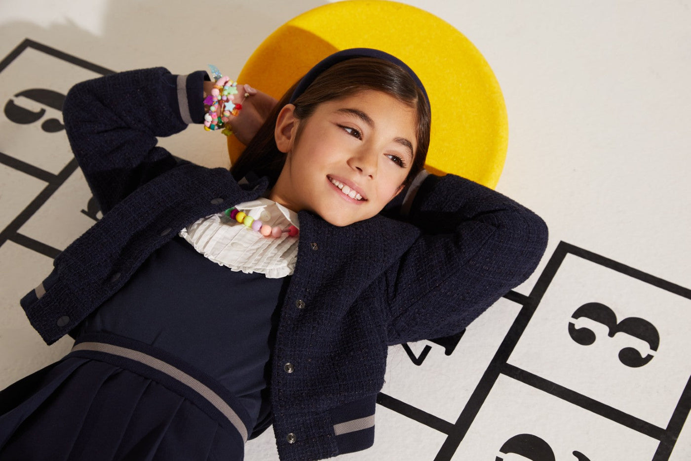 Blue jersey top with white front detail, woven cotton and elastane blend, perfect for active kids.