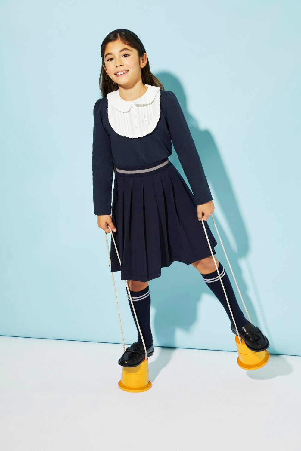 Blue jersey top with white front detail and collar