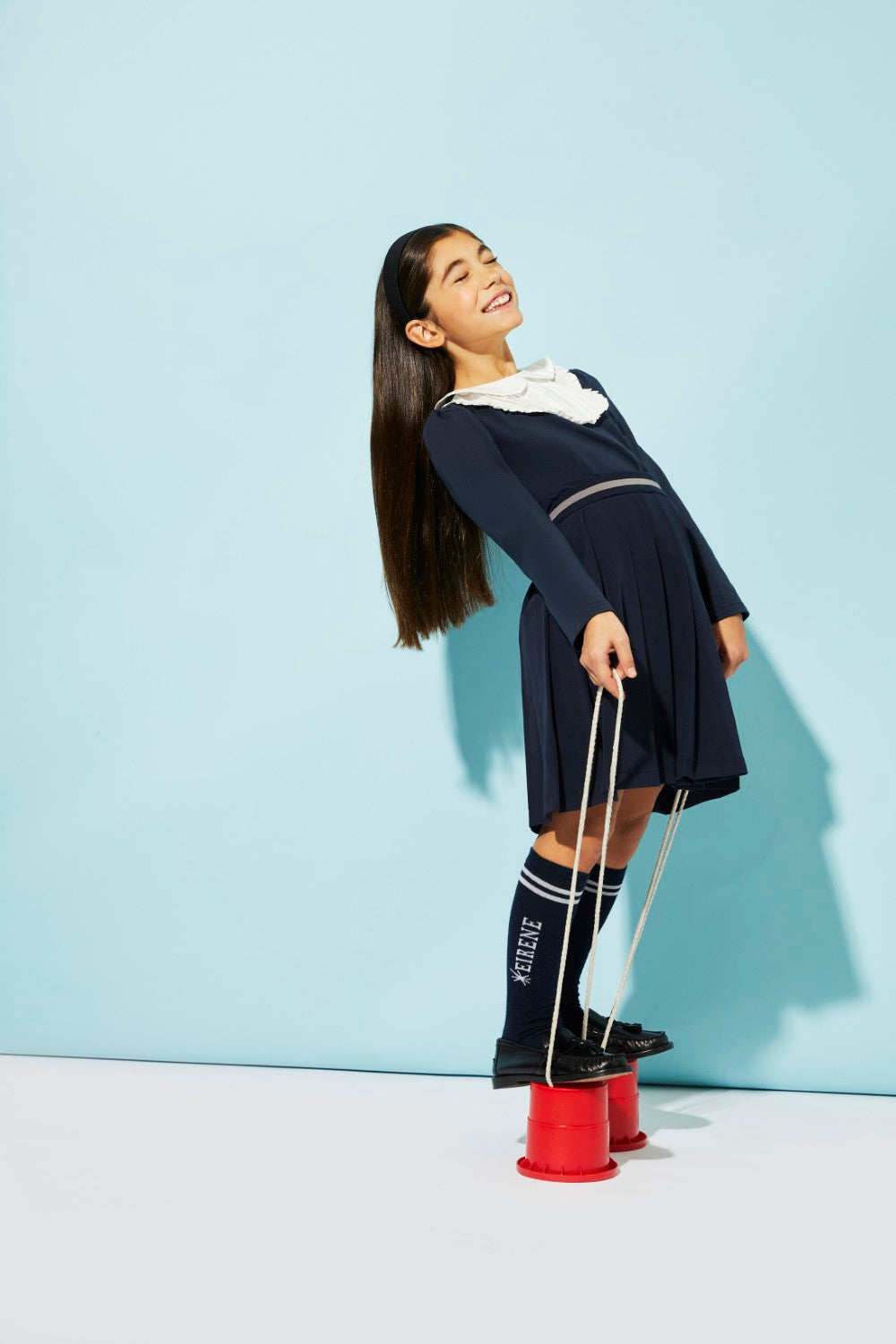 Blue jersey top with white front detail and collar