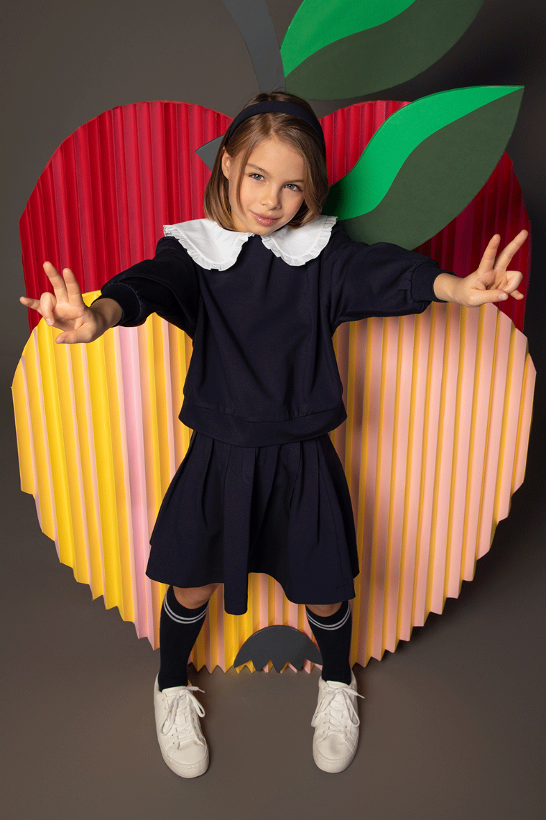 Navy blouse with long sleeves and white Peter Pan collar