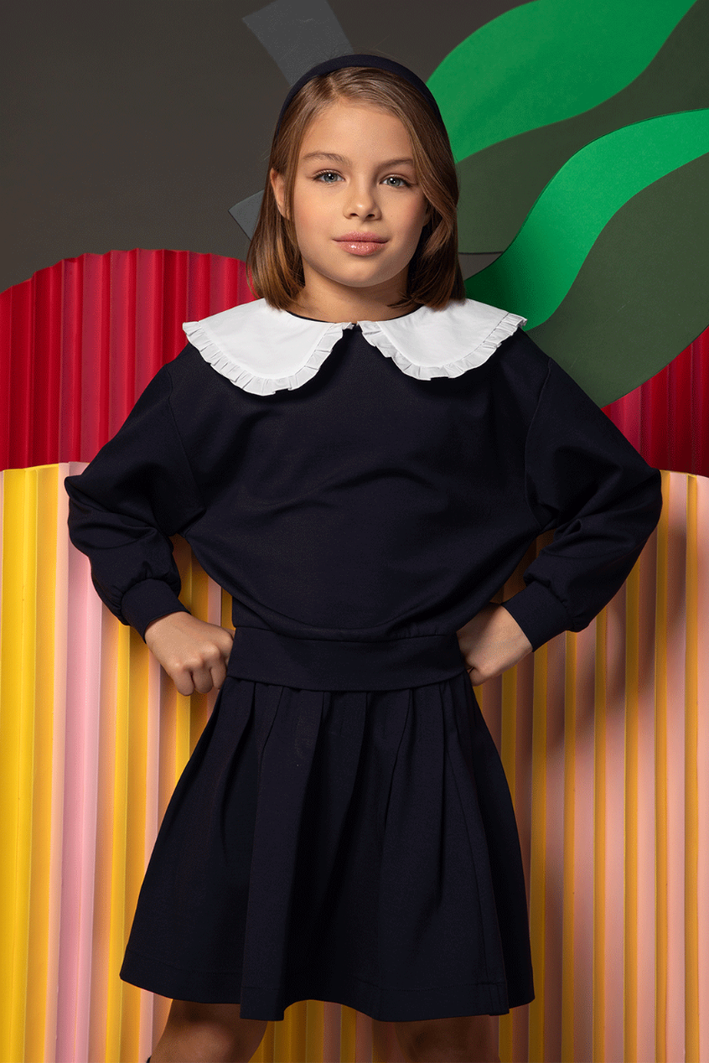 Navy blouse with long sleeves and white Peter Pan collar
