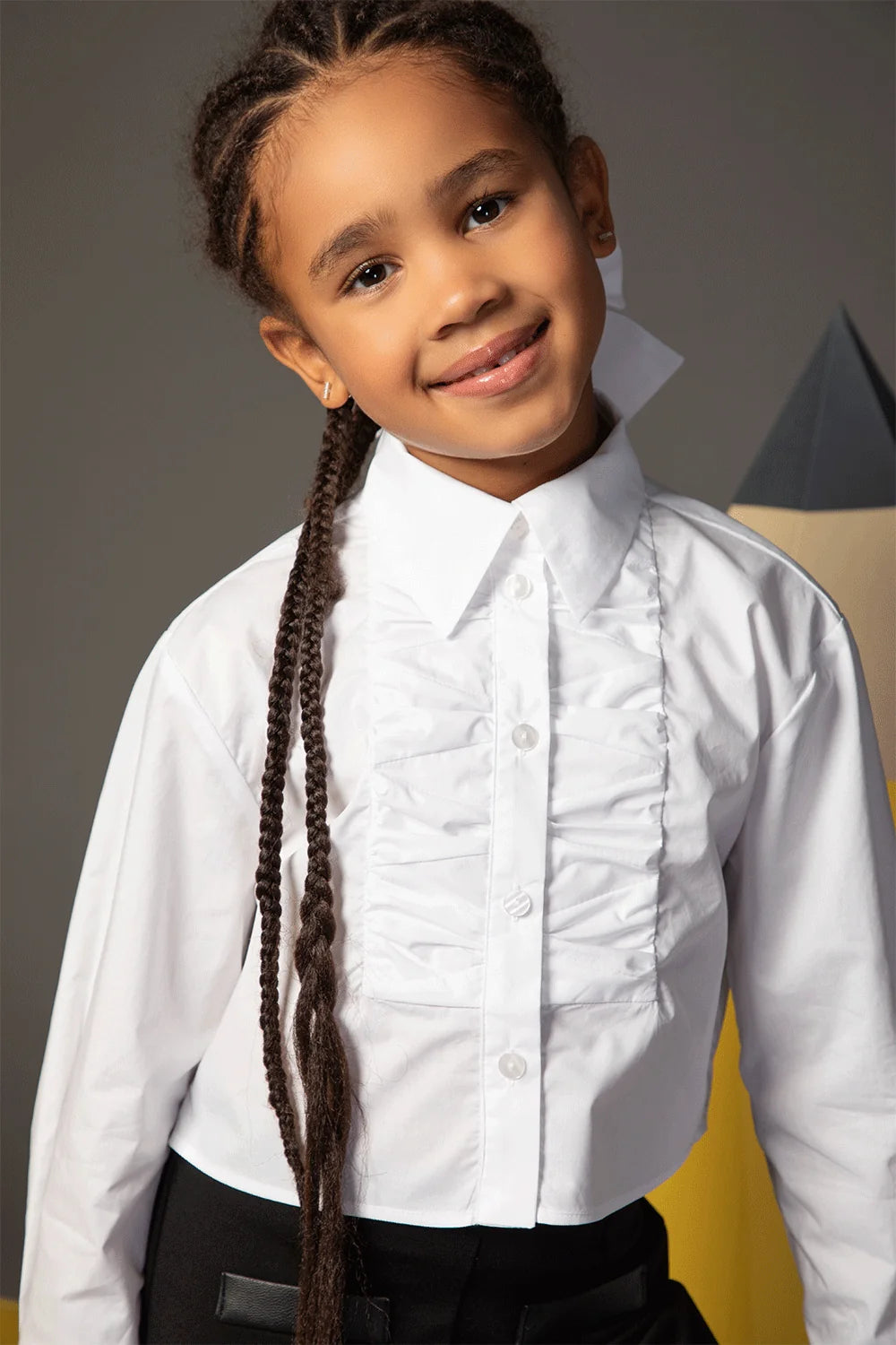 White cropped shirt with long sleeves, front ruffle and classic collar
