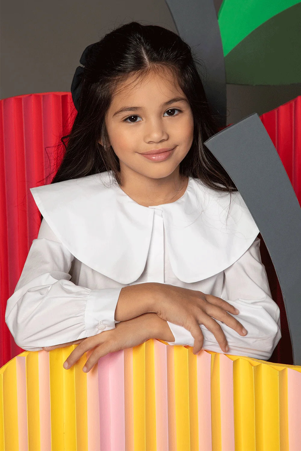 White blouse with shoulder ruffles, bows and oversized rounded collar